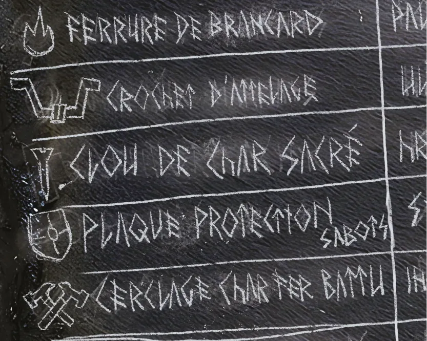 Chalkboard listing forged chariot parts in French, illustrated with runic icons.